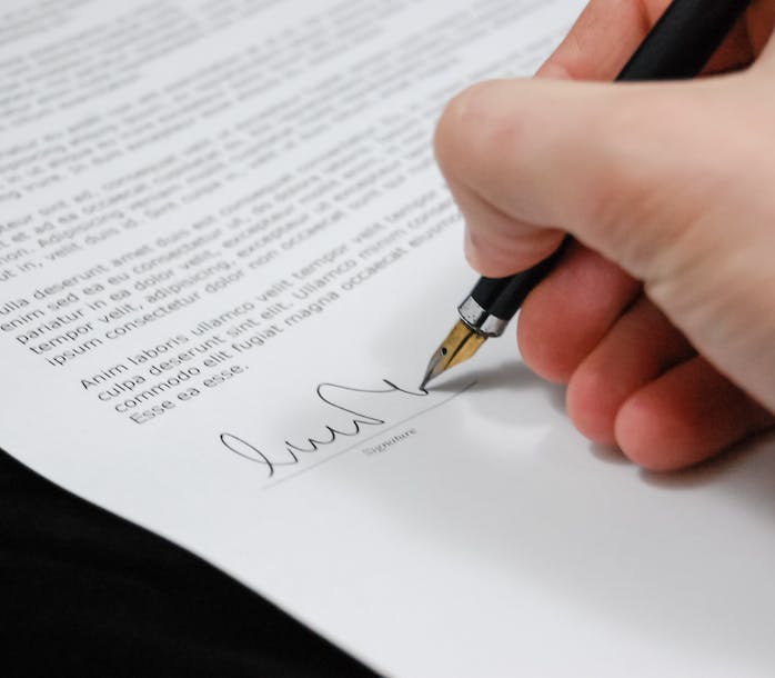 a person signing a document